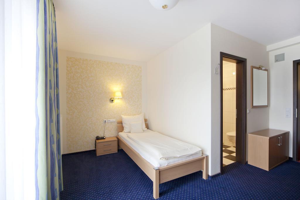 City-Hotel Фризойте Стая снимка