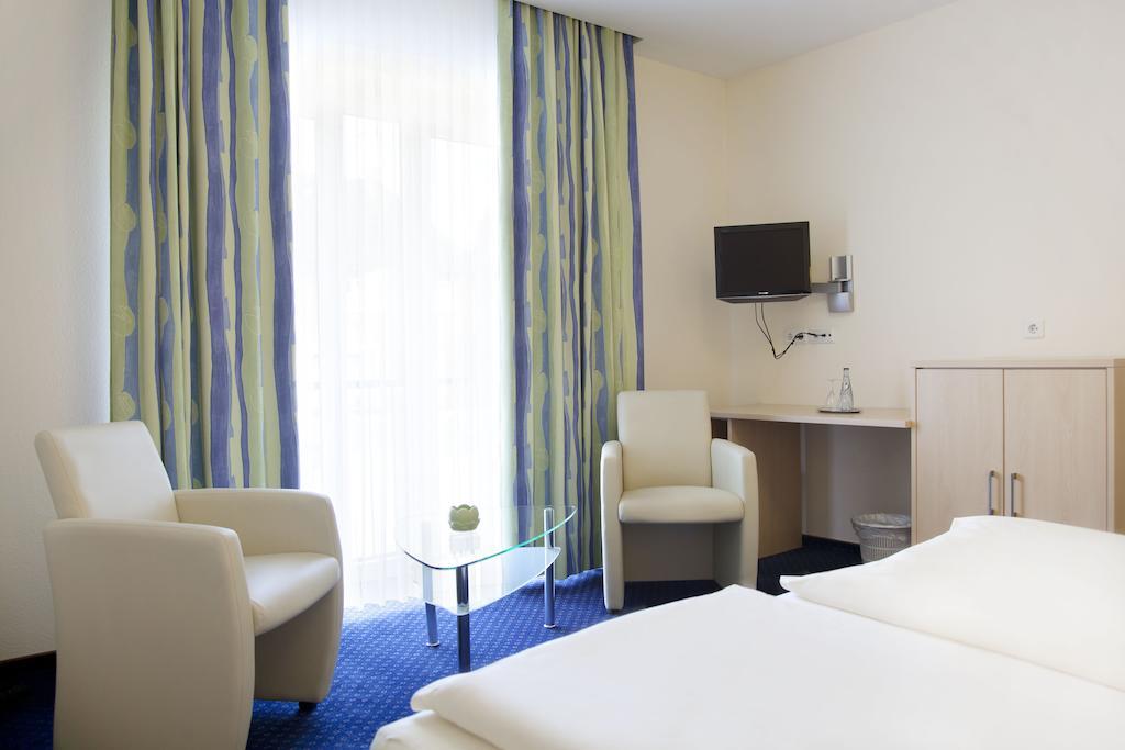 City-Hotel Фризойте Стая снимка